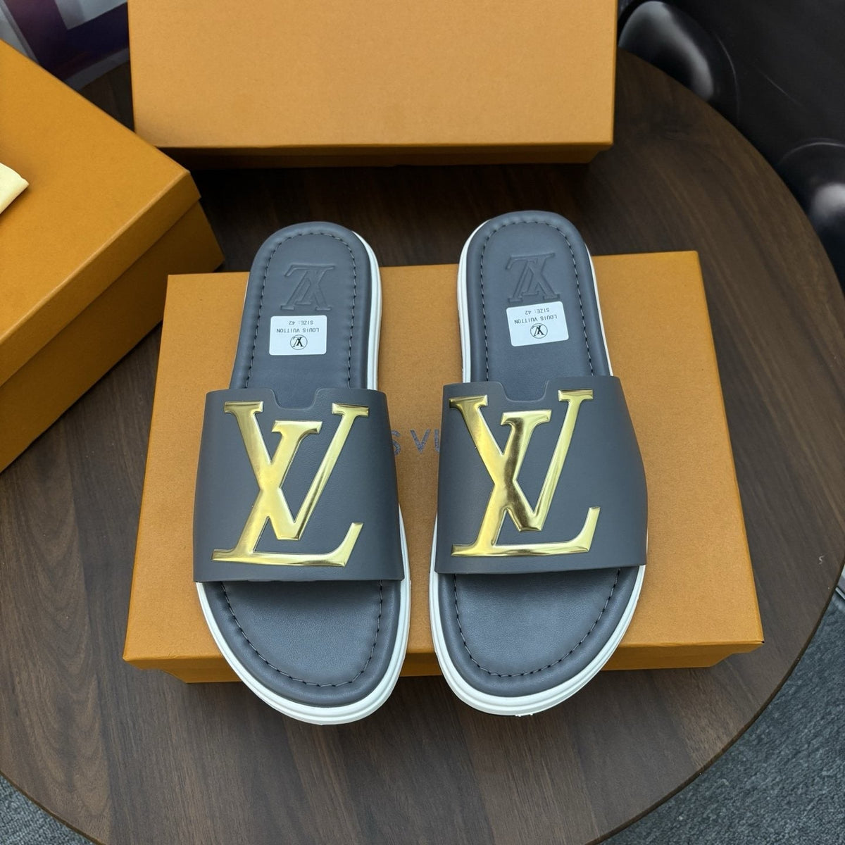 Louis Vuitton Raised-Monogram Slide Sandals — front