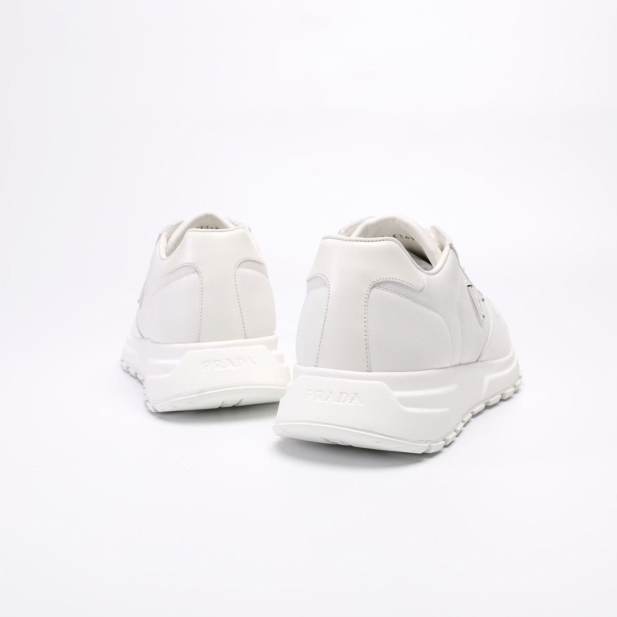 Prada Triangle Plaque Low-Top Sneakers — back